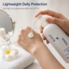 Cream X Emirates Body Lotion SPF 50 dispensed onto the hand showing its lightweight lotion texture