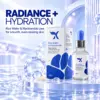 Cream X Emirates Rice Water and Niacinamide Premium Product View Cream X Emirates Rice Water and Niacinamide Face Serum bottle and box in a premium blue setting