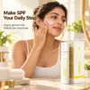 Applying Cream X Emirates Sunscreen SPF 50 Woman applying Cream X Emirates Sunscreen SPF 50 to her cheek