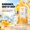 Cream X Emirates Vitamin C Face Serum – Premium Beauty Shot Cream X Emirates Vitamin C Face Serum 30 ml bottle and carton in an orange-gold and blue studio setting