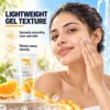 Cream X Emirates Vitamin C Gel Face Wash – Gel Texture Woman massaging Cream X Emirates Vitamin C Gel Face Wash onto wet skin beside the 100 ml tube